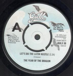 Year Of The Dragon - Let's Do The Latin Hustle/Over My Shoulder - 7 Inch